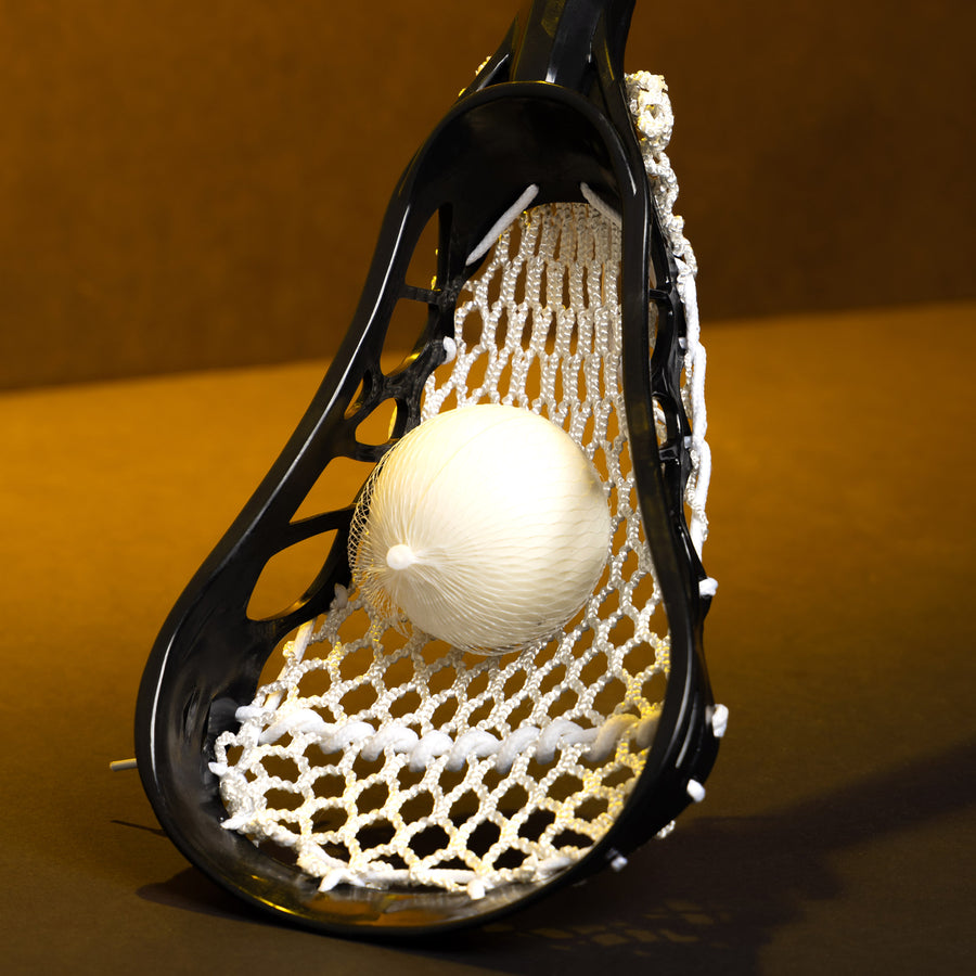 Sample mini lacrosse stick head with white mesh and ball